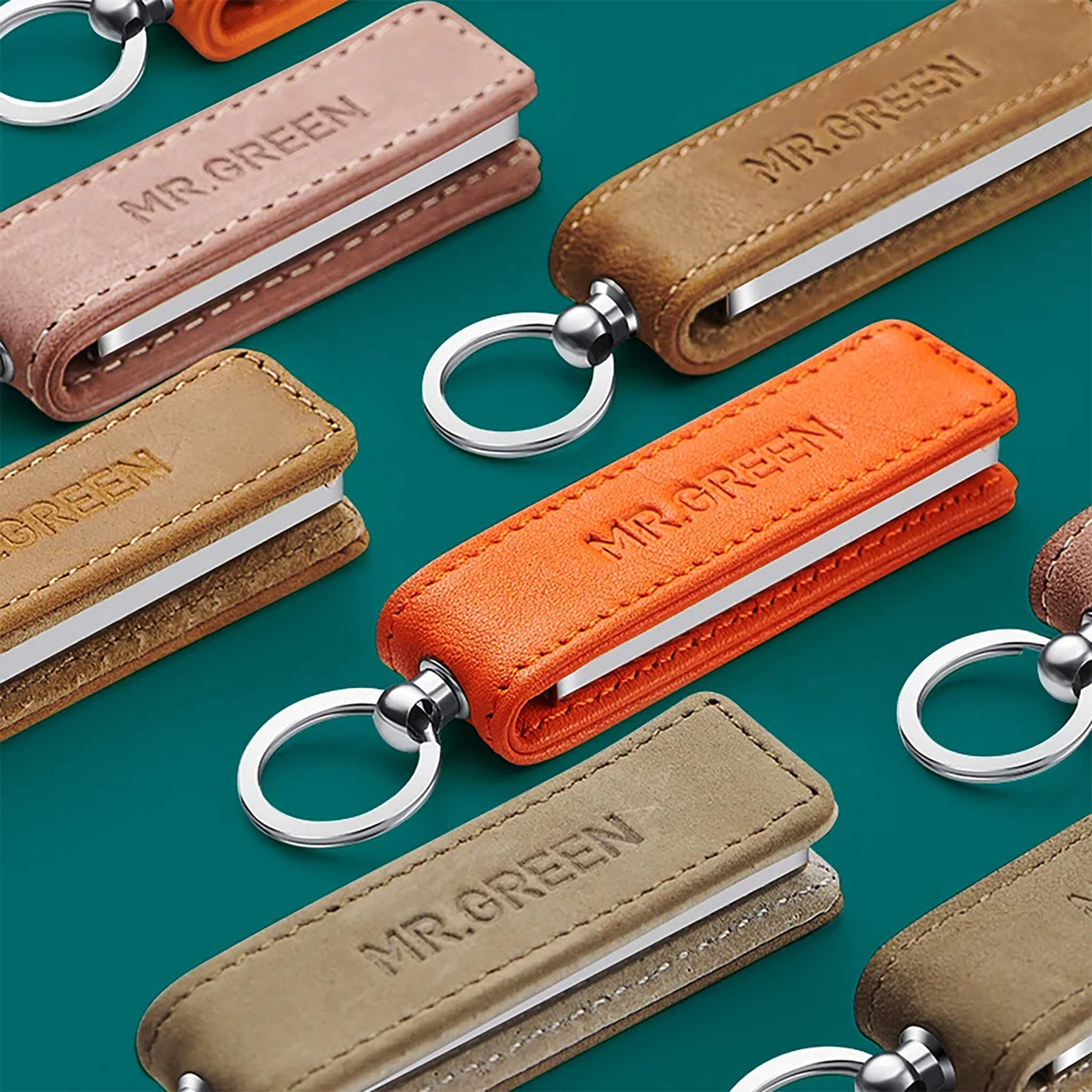 Cortauñas MR.GREEN 3003 ultrafino con funda de cuero naranja; compacto, plegable e ideal para viaje y regalo premium.