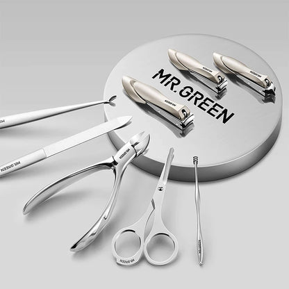 Ferramentas MR.GREEN Morandi Grey em aço inox: três cortadores, alicate, tesoura, pinça, lima de vidro e cureta sobre base.