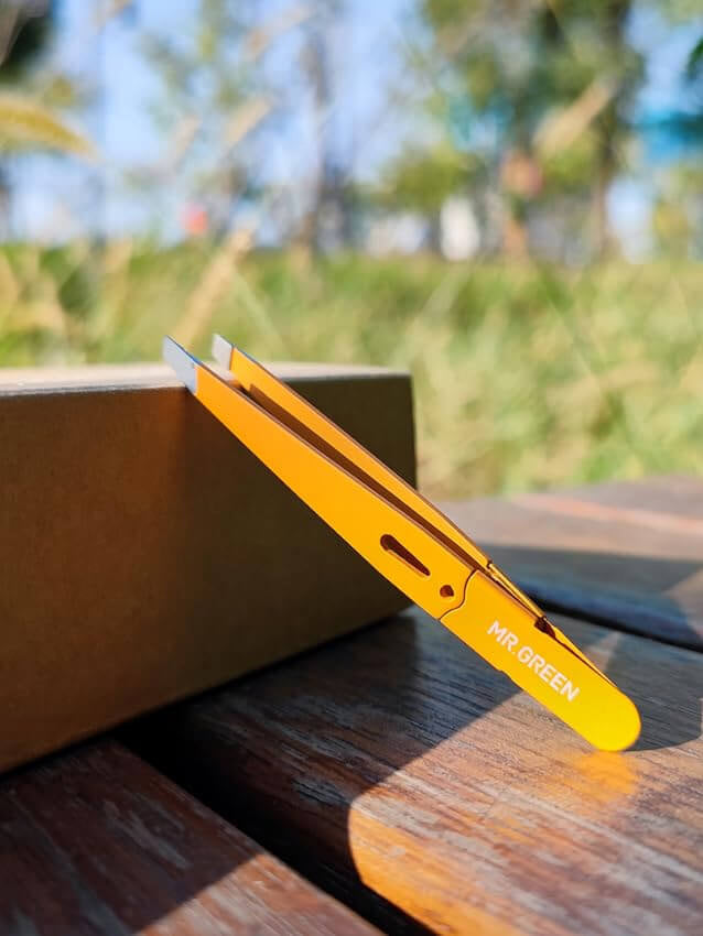 MR.GREEN slant eyebrow tweezers with anti-fingerprint yellow finish and precision stainless tips — salon-grade hair removal tool